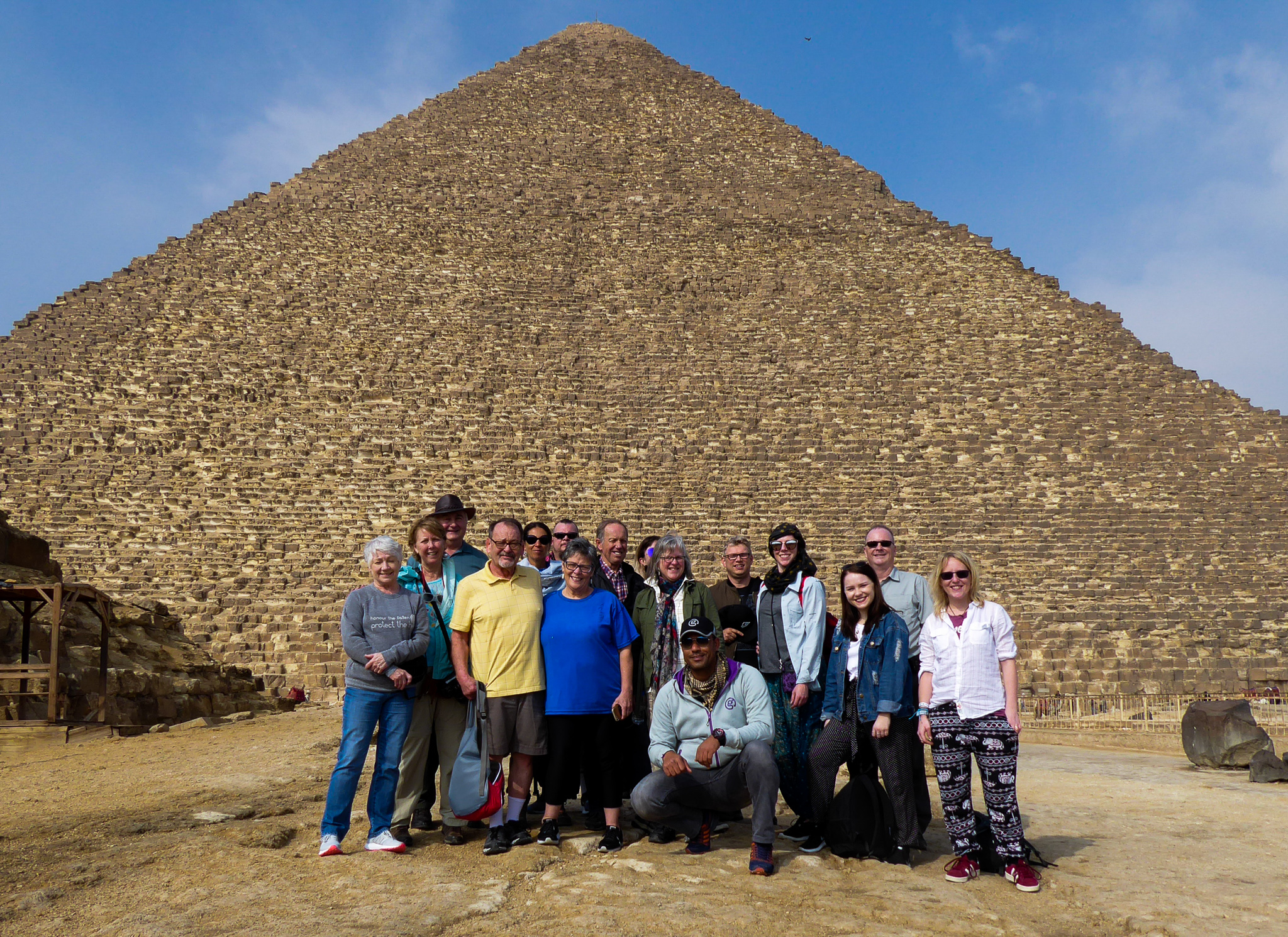 tour group standing in front of the great pyramid in Egypt